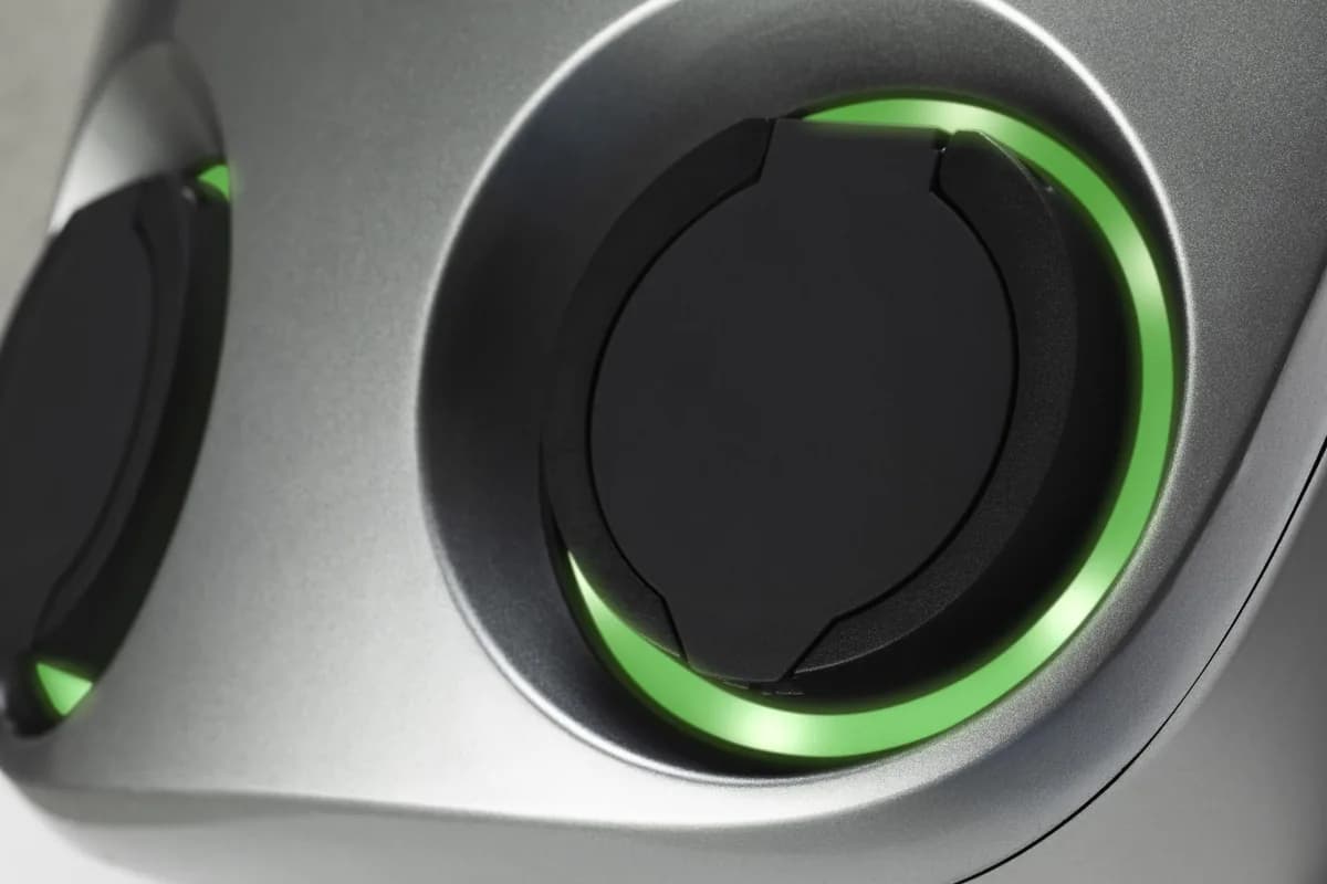 Close-up of the two charging socket covers and green light rings on a Charge Amps Aura